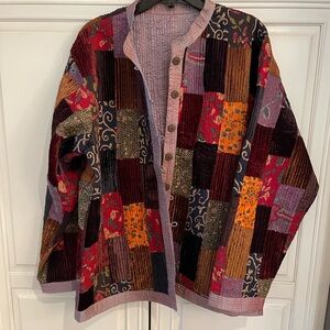 Vintage, reversible jacket, possibly a size large. The tag has been removed.